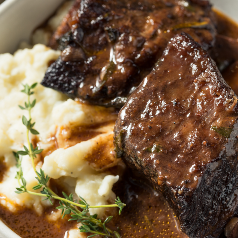 Beef Short Rib with Maple Whisky Peppercorn Sauce (GF) with Smashed Red Skin Colcannon, Grilled Broccolini & Roasted Squash
