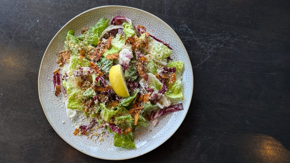 Endive & Radicchio Caesar Salad Caesar Vinaigrette | Coconut Bacon | Herb Pangrattato | Fresh Lemon 
